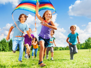 Many active kids with kite